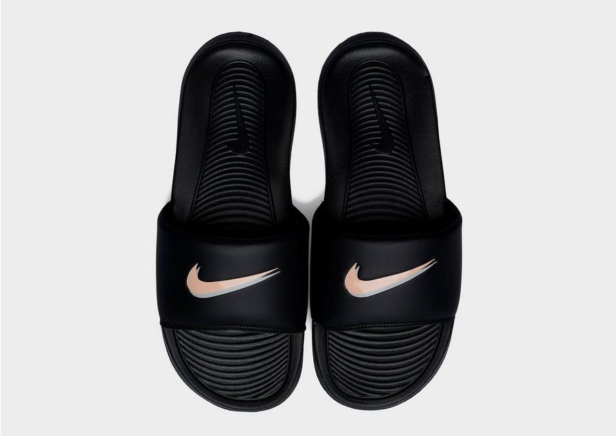 Black and gold nike slides best sale